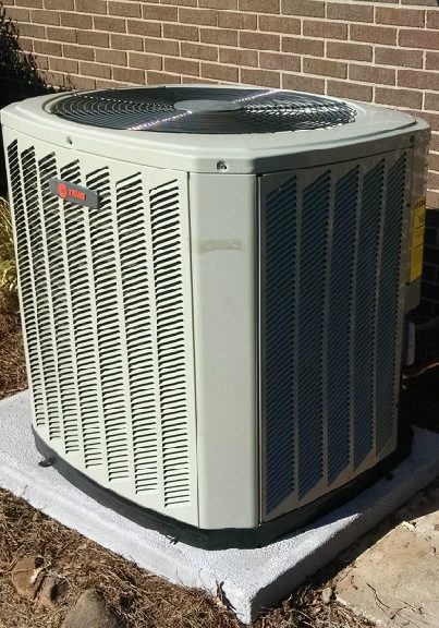 Single HVAC Unit connected to brick building